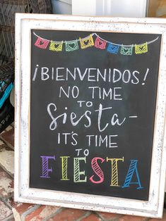 a chalkboard sign that reads, i benvendos no time siesta it's time fiesta