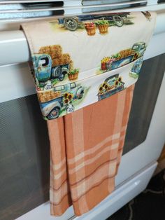 a kitchen towel hanging on the oven door