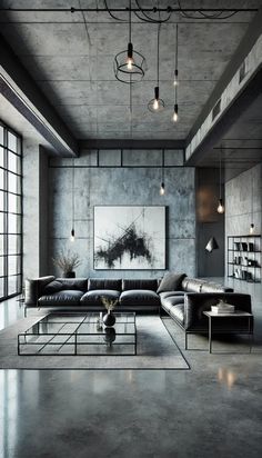 an industrial living room with concrete walls and flooring, black leather couches and coffee table