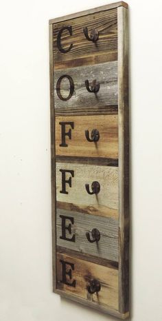 a wooden sign hanging on the side of a wall