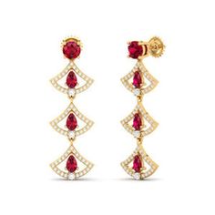 At the heart of these earrings lies the ruby, revered throughout history for its captivating red hue. With its deep crimson tones, the ruby evokes feelings of passion, desire, and vitality. Each gemstone within the Graduating Ruby Earrings seems to pulse with an inner flame, radiating warmth and energy that enchants all who behold them. Diamond weight is 0.69 & color stone weight is 2.44 NET WEIGHT (10K):4.90 NET WEIGHT (14K):5.51 NET WEIGHT (18K):6.59 Luxury Ruby Earrings With Prong Setting, Luxury Red Ruby Earrings, Red Ruby Diamond Earrings For Wedding, Ruby Earrings For Valentine's Day, Red Diamond Drop Earrings For Formal Events, Red Diamond Drop Earrings For Formal Occasions, Formal Red Diamond Drop Earrings, Luxury Ruby Gemstone Earrings, Red Diamond Teardrop Earrings