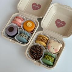 three plastic containers filled with different types of donuts