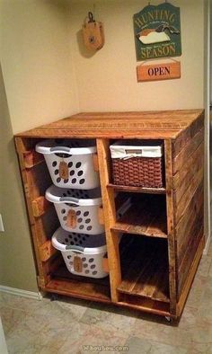 a wooden cabinet with baskets on top of it