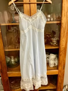 Gorgeous 1950's style nylon slip. Vintage Pale blue nylon slip. The back is square cut with non adjustable straps Very sweet and feminine. In excellent condition.  ERA 1950s FABRIC Nylon Label Reads: Bry-Nylon                          Chic Salon 34 Condition Excellent   No marks, no stains, no tears.   I post worldwide except for Germany. Thank you for your understanding.                                           Measurements: Bust 86cm/34inches  Waist 73cm/28.5 inches Length from underarm 82cm/ Monochrome Wardrobe, 1950s Fabric, Outfit Essentials, 60s 70s Fashion, Womens Lingerie, Vintage Slip, Beach Friends, Soft Fashion, Lingerie Vintage