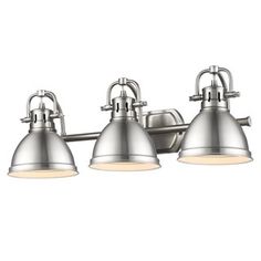 three light bathroom fixture with frosted glass shades on the sides and an old - fashioned brass finish