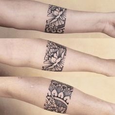 two arm tattoos with flowers on them