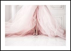 a woman's legs are covered in pink tulle