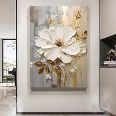 a large white flower painting on a wall