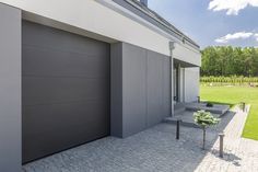 a modern house with an open garage door