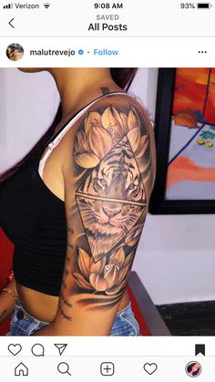 a woman with a tiger and flower tattoo on her arm is looking at the camera