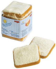 two pieces of bread with white frosting on them