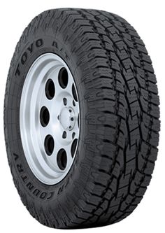 an all terrain tire with white rim and chrome spokes, on a white background