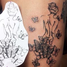 a woman's thigh with butterflies on it and a piece of paper attached to the side