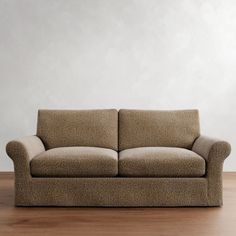 a couch sitting on top of a hard wood floor