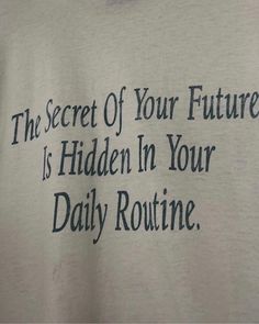 a t - shirt that says the secret of your future is hidden in your daily routine