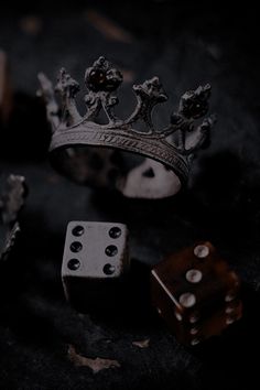 two dices and a crown on a table