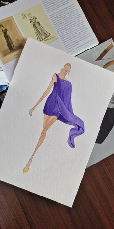 a drawing of a woman in a purple dress on top of a table next to cd's