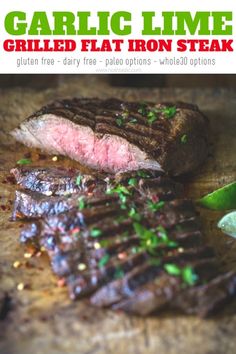 grilled flat iron steak on a cutting board with garnish and green pepper