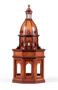 an old wooden clock tower on a white background