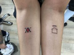 two people with matching tattoos on their legs, one has an x and the other has a bag