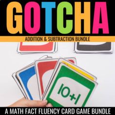 a hand holding four cards with the words gotcha addition and subtraction bundle