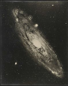 an old photo of the andromidus galaxy in black and white with stars