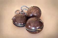 three chocolate covered objects sitting on top of a table