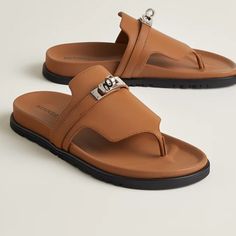 Designer Toe Post Sandals For Summer, Leather Sandals With Round Toe In Sand Color, Sand Colored Leather Sandals With Round Toe, Sand Leather Sandals With Round Toe, Sand-colored Leather Sandals With Round Toe, Designer Leather Flip Flops For Summer, Luxury Leather Open Toe Flip Flops, Designer Leather Flip Flops For Beach, Designer Leather Flip Flops For The Beach