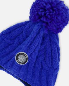 Detailed with a cozy lining, our Peruvian Knit Hat Royal Blue puts the perfect finishing touch on any cold weather look. This adorable winter hat features a chunky cable knit texture with earflaps, a fluffy pompom on top, and braided tassels that hang on each side. Team with a matching neckwarmer for added warmth and total coordination! Earflap hat Pompom Braided tassels 58% Acrylic,15% Nylon, 27% PBT - Lining: 94% Polyester, 6% Elastane Fits true to size From 2 years to 16 years Braided Tassels, Chunky Cable Knit, Knit Texture, Dress Gift, Knit Hat, Winter Hat, Neck Warmer, Cable Knit, Cold Weather