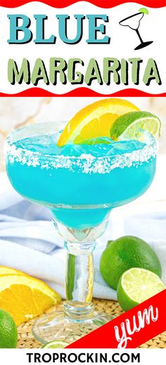 a blue margarita cocktail with limes and salt on the rim