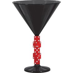 a black vase with red and white polka dot decorations on it's sides is shown in front of a white background