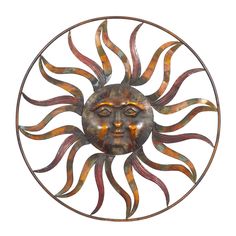 a metal sun face is shown in the middle of a circular wall art piece on a white background