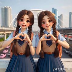 two girls making heart with their hands while standing in front of a cityscape