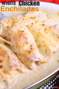 white chicken enchiladas in a green and white bowl