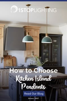 a kitchen island with two pendant lights over it and the words, how to choose kitchen island pendant lights read our blog