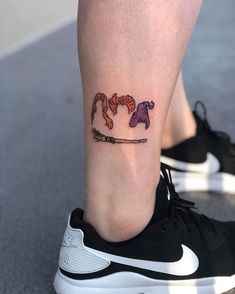 a woman's foot with a tattoo on her left leg and the word love written across it