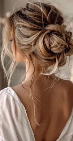 Transform your long locks with 27 stunning messy bun ideas that blend casual charm and elegance. These chic updos offer endless possibilities for both relaxed and formal settings. From textured high buns to relaxed low styles, find the ideal messy bun to showcase your long hair. Embrace these trendy, low-maintenance hairstyles that exude effortless beauty and sophistication. Messy Formal Hair, Bridesmaid Low Messy Bun, Bridal Bun Messy, Up Dos Bridesmaids, Bridemaids Hairstyles Messy Bun, Boho Updo Medium Length, Wedding Hairstyles Updo Elegant Classy, Up Dos For Wedding Bridesmaid, Messy Bun Wedding Hair With Veil