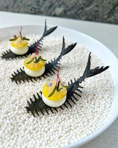 three devil's horns are arranged on top of some boiled eggs