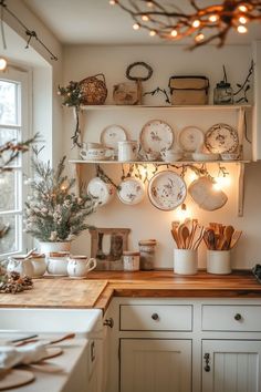 a kitchen filled with lots of white dishes