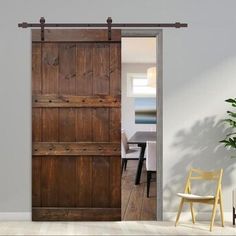 an open wooden door in a white room