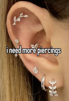 a woman with ear piercings that says i need more piercings