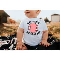 a baby sitting on the ground wearing a t - shirt that says icy sticky birthday boy