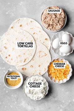 the ingredients for tortillas laid out on top of each other, including eggs, cheese and sour cream