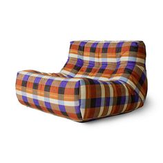 an orange and purple checkered chair sitting on top of a white floor