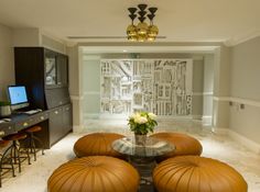 a living room filled with furniture and a flat screen tv