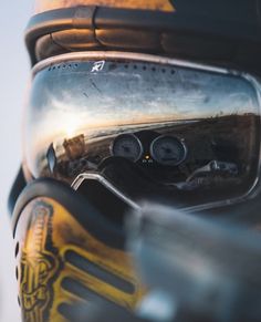 the reflection of a person wearing skis in their goggles