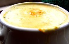 a close up of a bowl of soup on a table