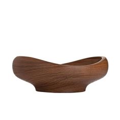 a wooden bowl that is shaped like a wave