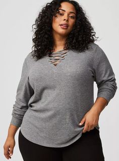 FIT Measures 31” from shoulder (size 2). MATERIALS + CARE Waffle knit fabric. 64% polyester, 33% rayon, 3% spandex. Machine wash cold. Tumble dry low. Imported. DETAILS V-shaped neckline. Long sleeves. The best plus size women's waffle lace up v-neck long sleeve top lace-up tops in heather grey made of waffle. Torrid is your destination for cozy fall and winter clothes to keep you warm and comfortable. Long Sleeve Sweatshirt, Winter Clothes, Cozy Fall, Waffle Knit, Long Sleeve Sweatshirts, V Shape, Heather Grey, Knit Fabric, Winter Outfits