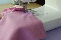 a sewing machine with a pink cloth on it